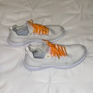 APL white sneakers orange laces